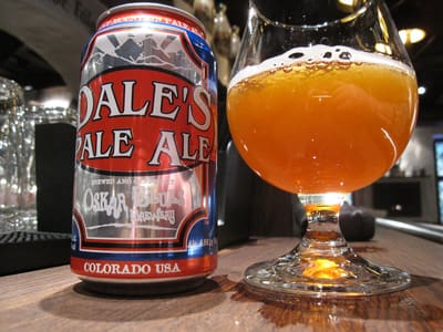 A can of Dale's Pale Ale beside a full glass