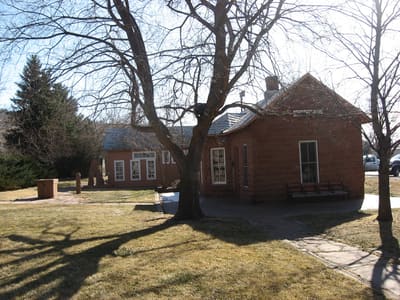 The 1885 sandstone Lyons Depot on Broadway in winter light